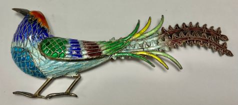 A silver champlevé enamelled bird of paradise brooch, in bright colours with long tailfeathers, 10cm