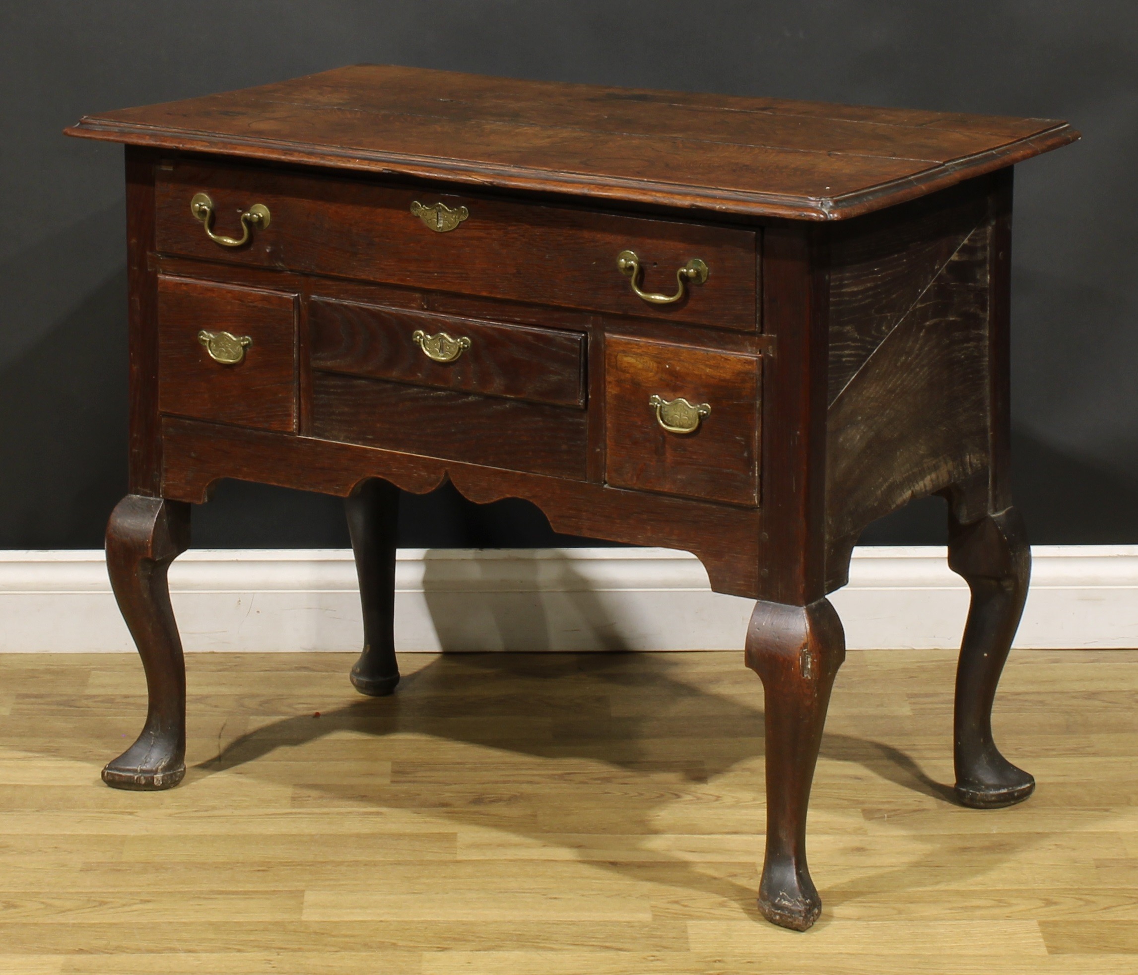 An 18th century oak lowboy, rectangular top with reentrant foreangles above four drawers, shaped - Image 5 of 6