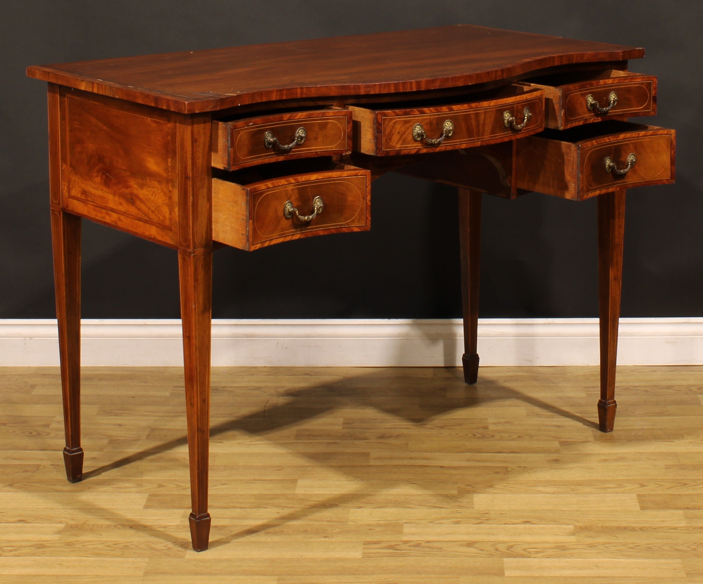A Sheraton Revival satinwood banded mahogany serpentine serving table, oversailing top above five - Image 4 of 6