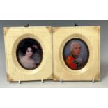 A reproduction pair of white framed oval miniatures, a gentleman and lady, each 13.5cm high, 12cm