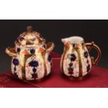 A Derby Crown Porcelain Company Imari palette 1128 pattern milk jug and two handled sucrier and