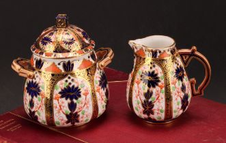 A Derby Crown Porcelain Company Imari palette 1128 pattern milk jug and two handled sucrier and