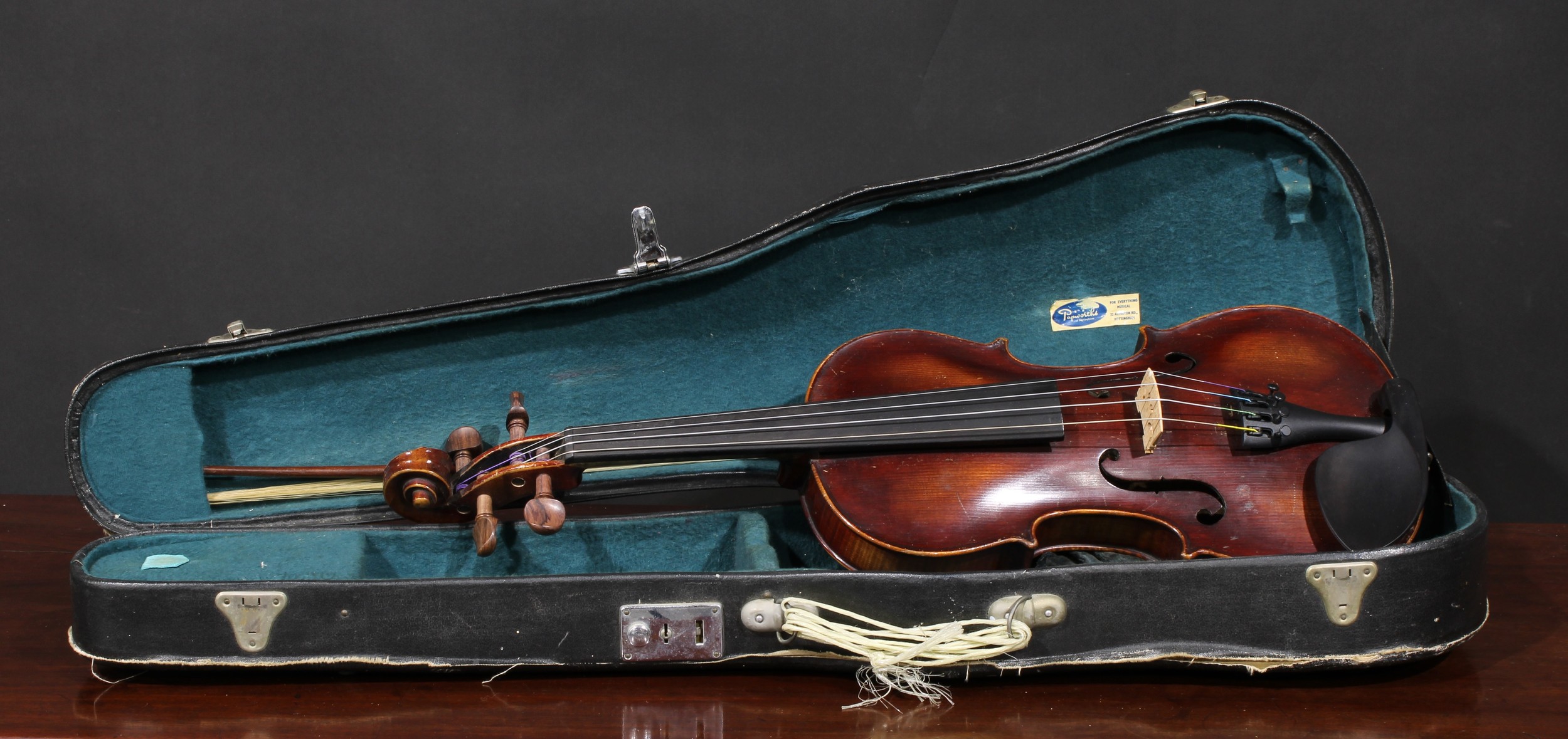 A German violin, the two-piece back 35.5cm long excluding button, paper label printed Copy of