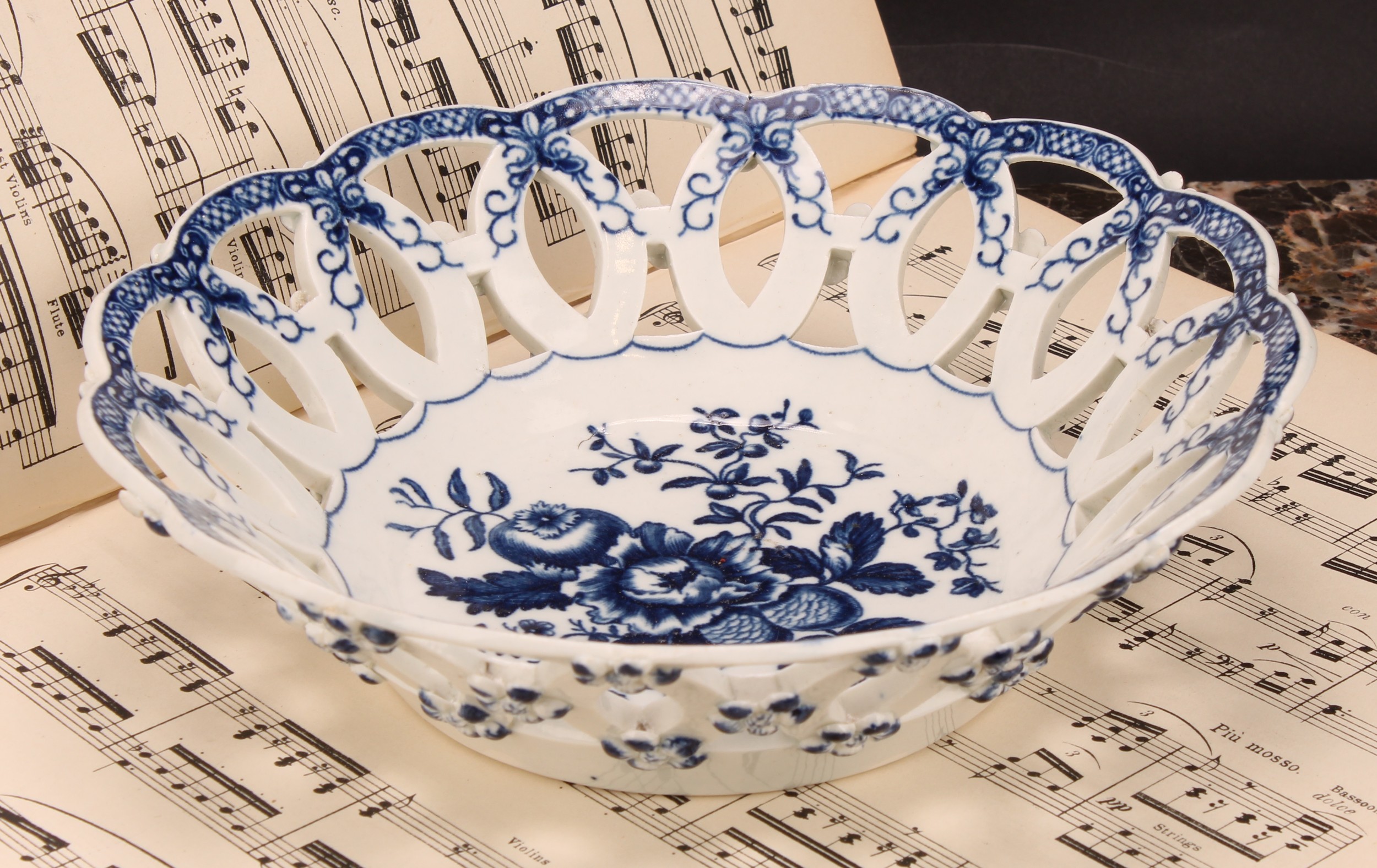 A Worcester Pine Cone pattern shaped circular basket, printed in underglaze blue with peony