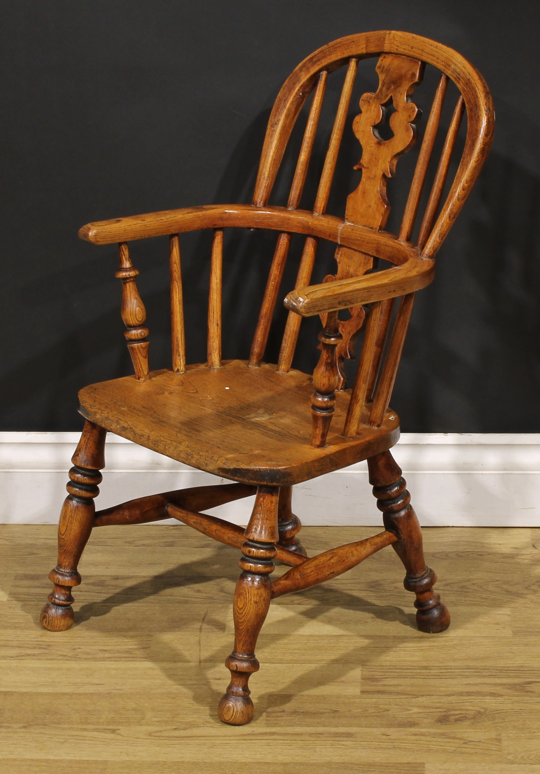 A 19th century ash and elm child’s Windsor elbow chair, pierced ‘Christmas tree’ splat, 67cm high, - Image 3 of 4
