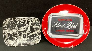 A Bristol Pottery advertising plate, Carling Black Label Lager Beer; a Denby experimental rounded