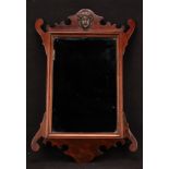 A George II Revival mahogany Vauxhall looking glass, rectangular mirror plate, shaped cresting