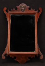 A George II Revival mahogany Vauxhall looking glass, rectangular mirror plate, shaped cresting