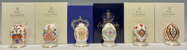 A set of six Royal Crown Derby Eggs of The World, comprising Italy, England, Greece, Japan, India