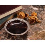 A Victorian silver mounted tortoiseshell circular dressing table trinket dish, pierced and chased