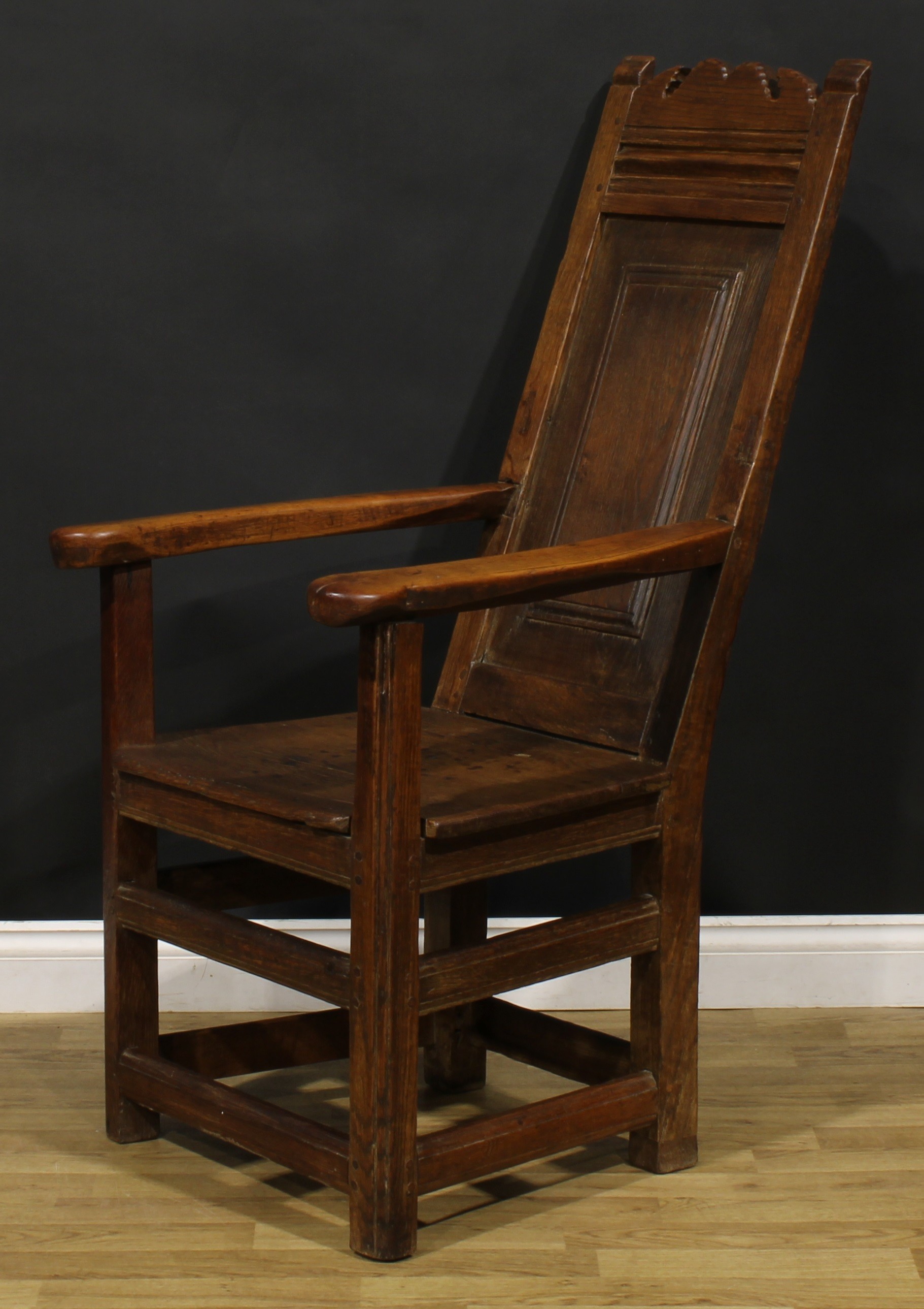 An 18th century and later oak and fruitwood caquetoire or panel-back armchair, possibly Scottish, - Image 3 of 4
