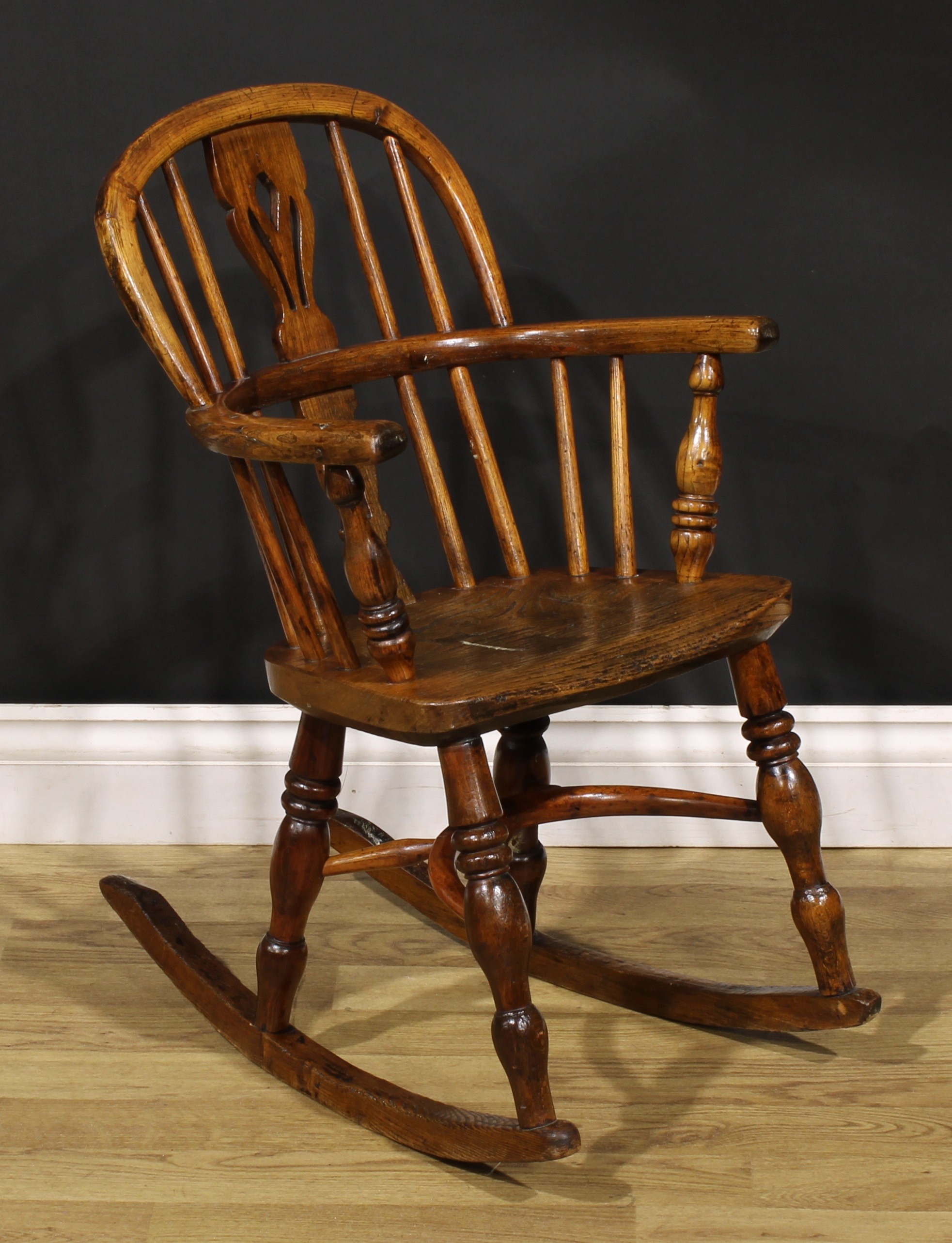 A 19th century ash and elm child’s Windsor rocking chair, pierced splat, yew crinoline stretcher, - Image 2 of 4