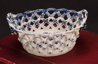 An Lowestoft Pine Cone pattern two-handled oval basket, central oval reserve painted in underglaze