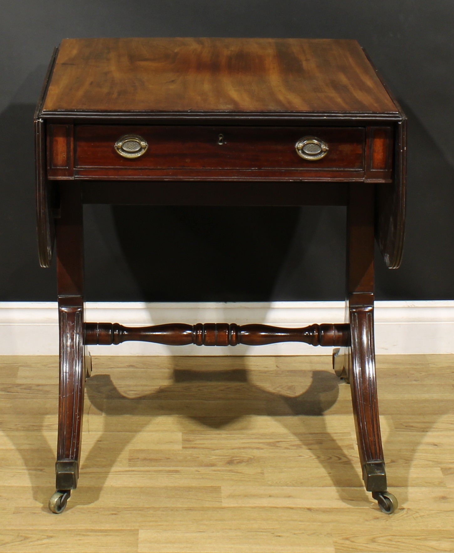 A 19th century mahogany sofa table, rounded rectangular top with fall leaves above a frieze - Image 2 of 7