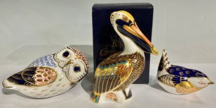 A Royal Crown Derby paperweight, Brown Pelican, gold stopper, boxed; others, Owl, silver stopper;
