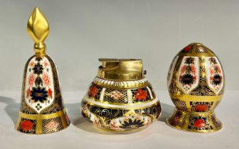 A Royal Crown Derby 1128 Old Imari pattern egg on stand, solid gold band, 8.5cm high overall,