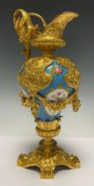 An early 20th century French gilt metal mounted ewer, in the manner of Sevres, painted with panels