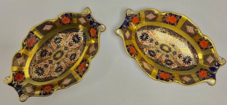 A pair of Royal Crown Derby Imari palette 1128 pattern oval trinket dishes, solid gold band,