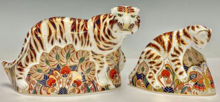 A pair of Royal Crown Derby paperweights, Bengal Tiger and Bengal Tiger Cub, gold stopper, printed