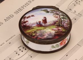 A 19th century enamel circular table snuff box, hinged cover painted with young shepherds in a