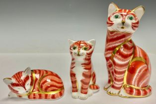 A Royal Crown Derby paperweight, Ginger Cat, silver stopper, 13cm, printed mark; two Ginger Kittens,