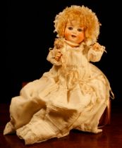 A Heubach Koppelsdorf (Germany) bisque head and painted composition bodied doll, the bisque head