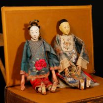 An early 20th century Chinese 'Opera' doll, the white painted composition head with painted