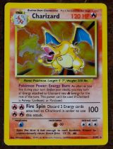 Pokemon, Pokemon Trading Cards – a Charizard 4/102 holographic foil trading card with shadow, from