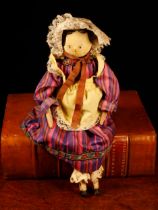 Folk Art - an early 20th century Grödnertal or 'Dutch' peg doll, the carved and painted head with