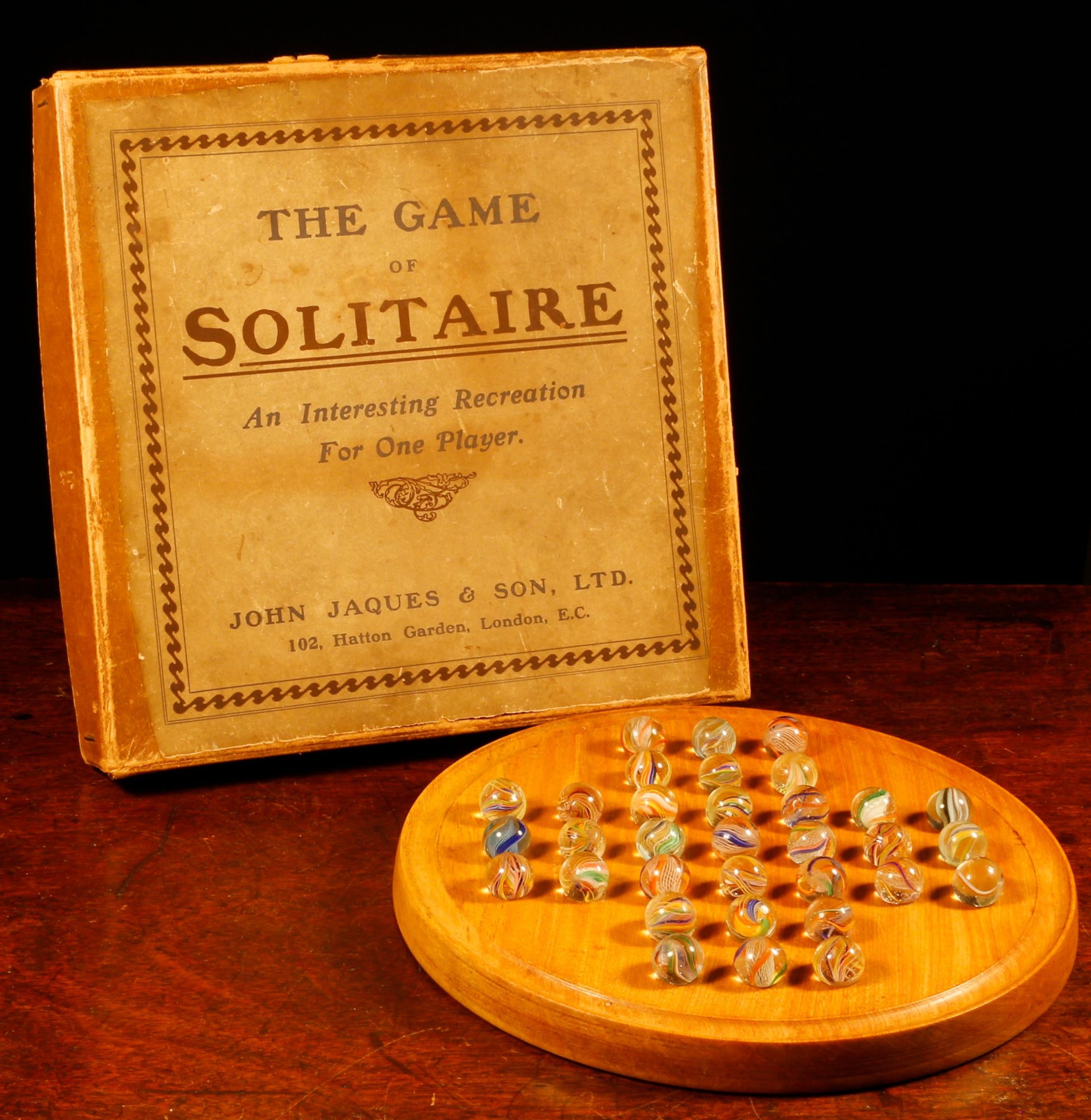 Parlour Games - a John Jaques & Son Ltd. circular solitaire board, comprising thirty three glass