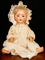 A Heubach Koppelsdorf (Germany) bisque head and painted composition bodied doll, the bisque head