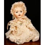 A reproduction bisque head and painted composition bodied doll, the bisque head inset with blue
