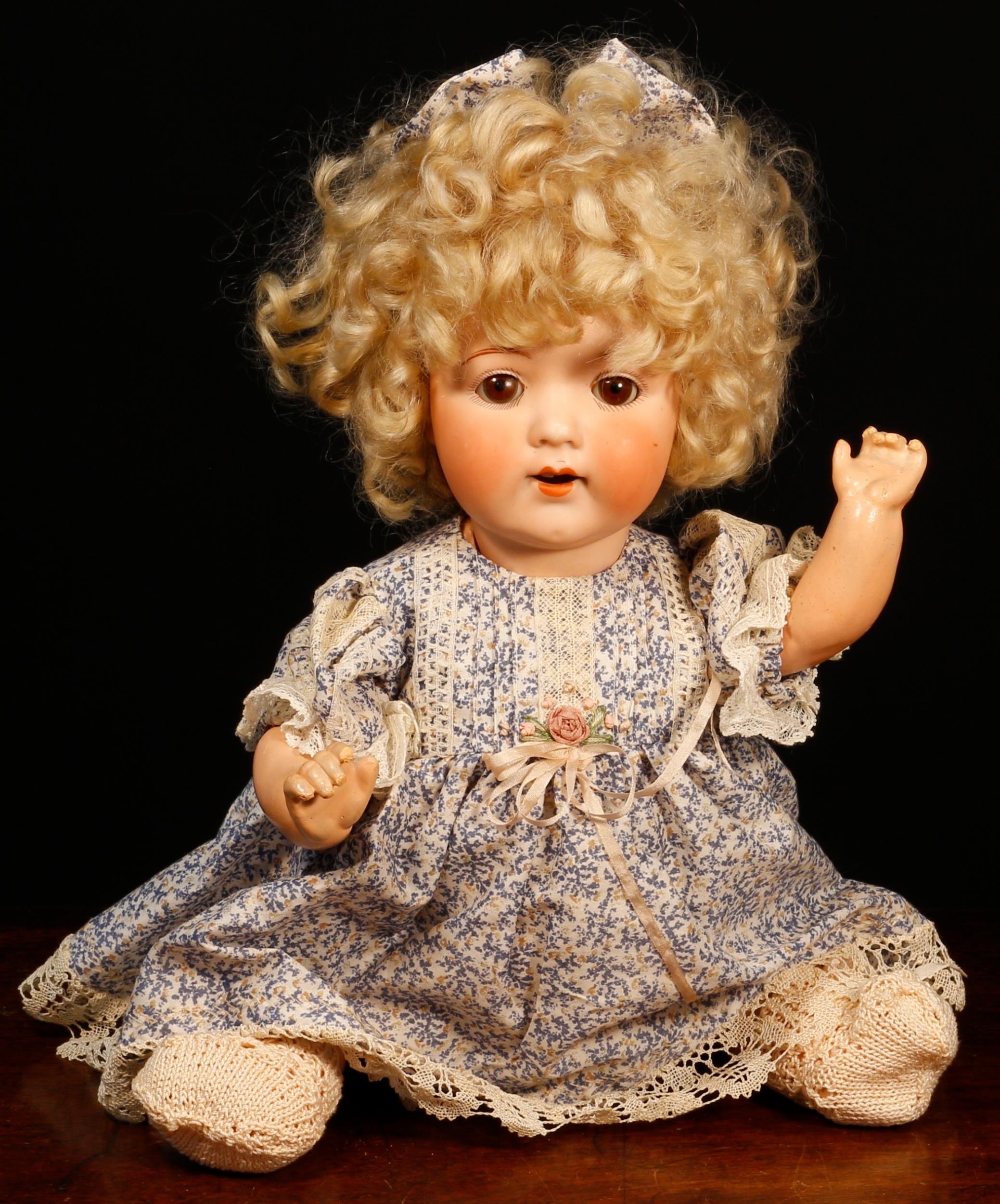 An Armand Marseille (Germany) bisque head and painted composition bodied doll, the bisque head inset