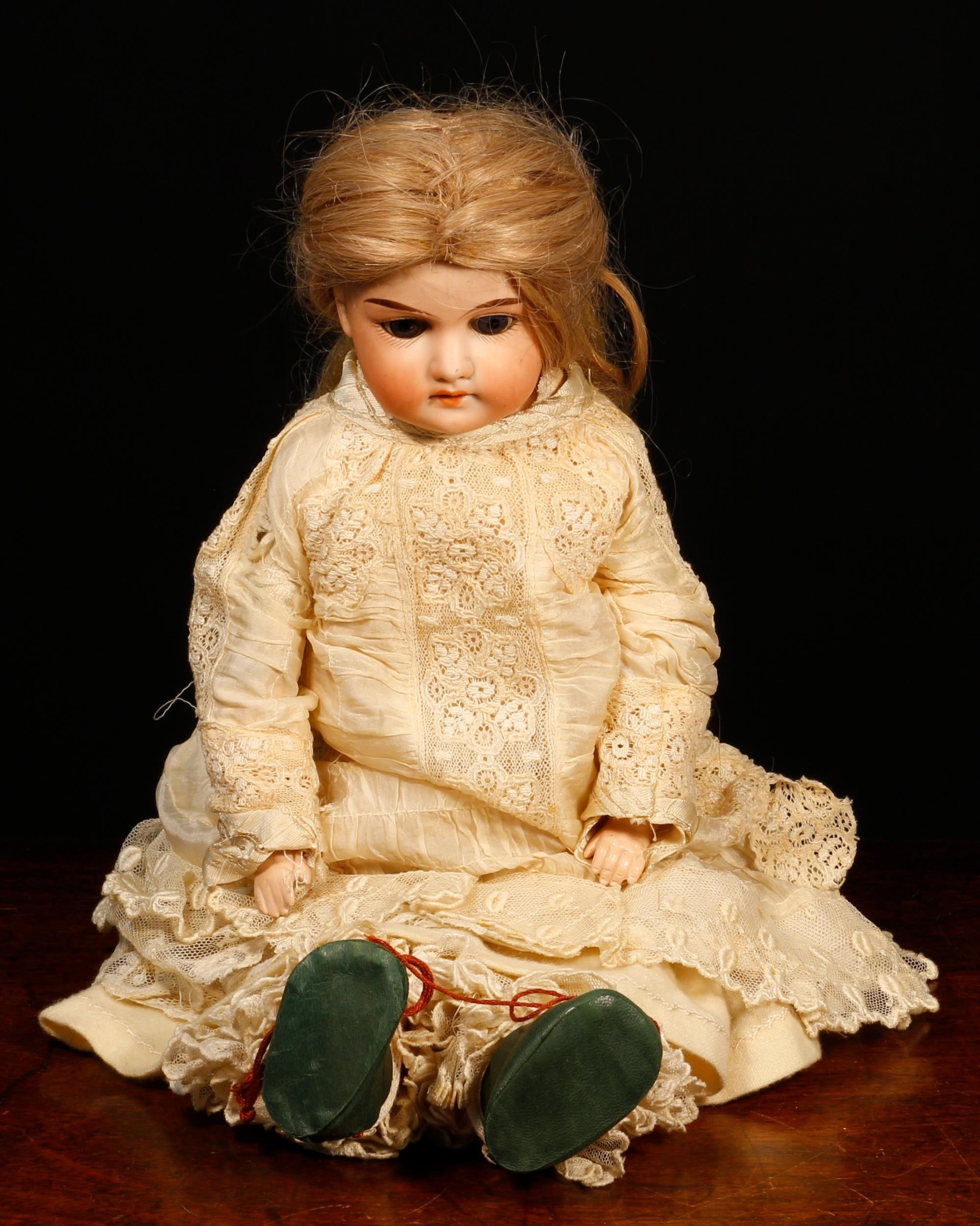 An Armand & Marseille (Germany) bisque shoulder head and partially kid leather bodied doll, the