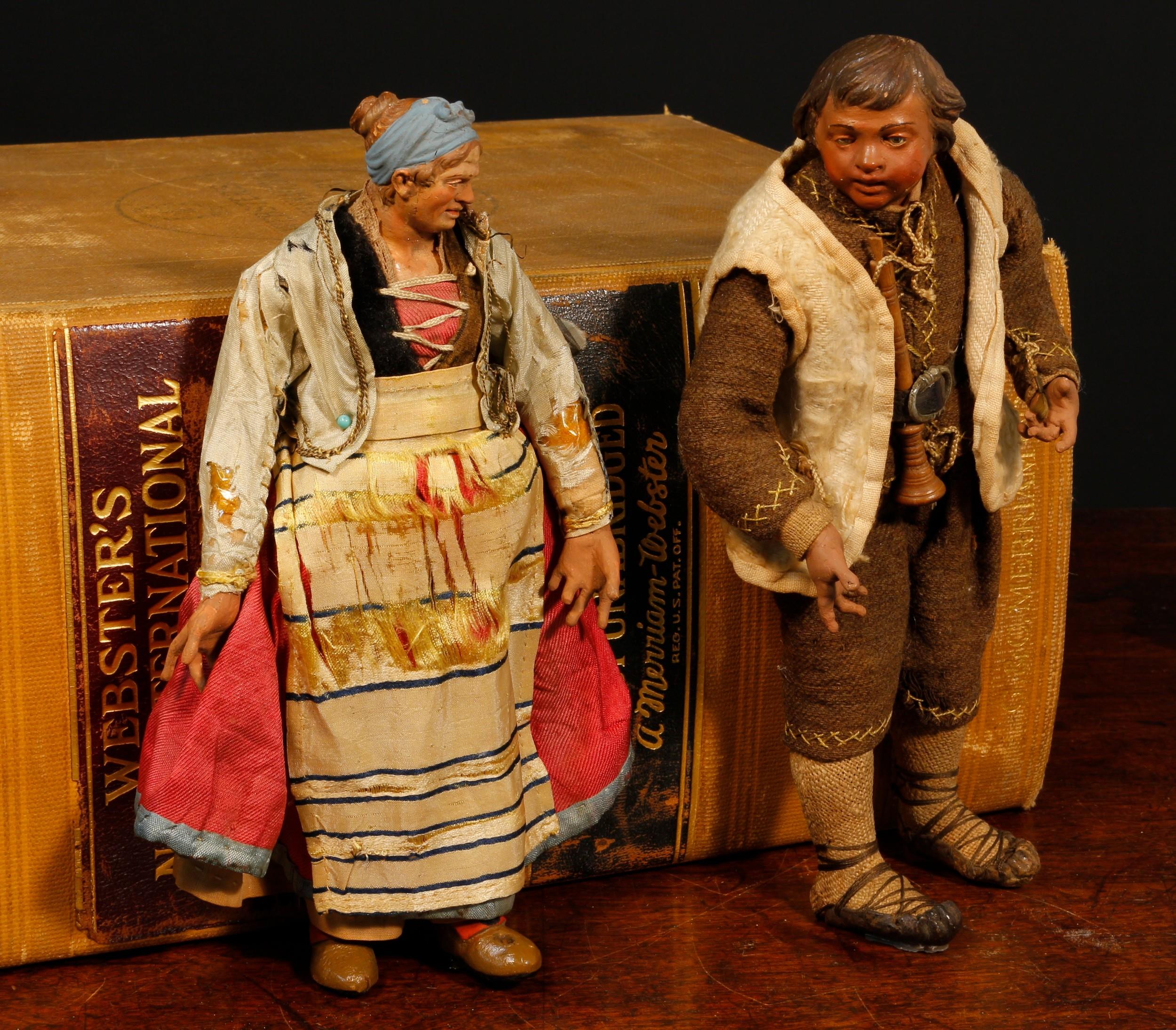 A 19th century Neapolitan creche figure, modelled as a male, the sculpted and painted head inset