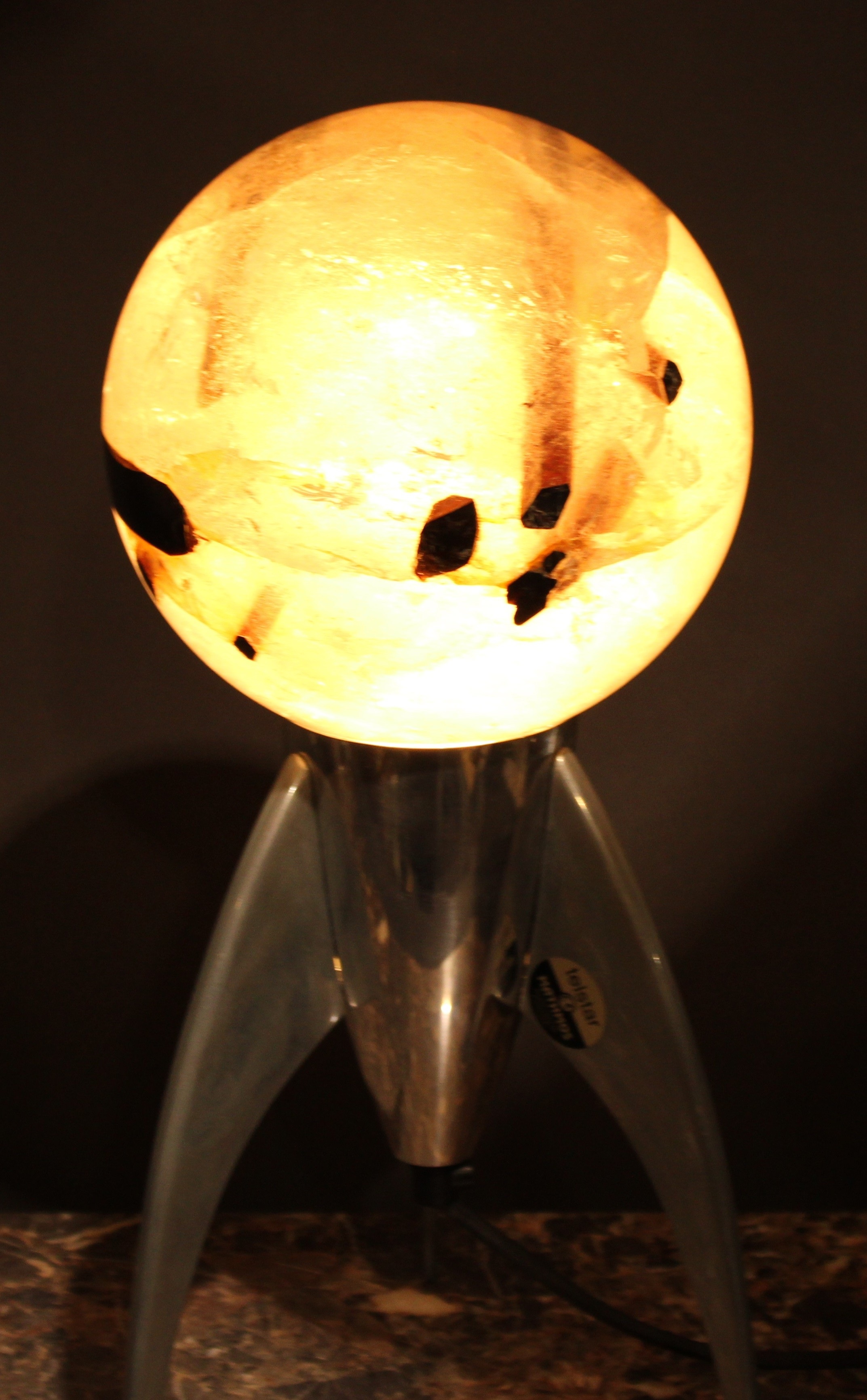 Geology - a tourmalated quartz sphere, 16cm diameter, mounted for display on a Telstar rocket lava - Image 7 of 7