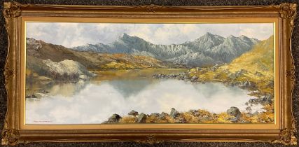 Charles Wyatt Warren (1908-1993), Welsh mountain tarn, signed, oil on board, 37cm x 90.5cm.