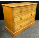 An Edwardian pale oak chest of drawers, 84.5cm high x 106cm wide x 54cm deep.