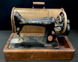 A Singer hand crank sewing machine, reg.no F6121599, cased