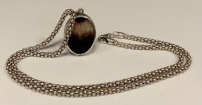 An oval Blue John fluorite double sided silver mounted oval pendant necklace, Greek key mount, on
