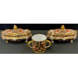 Royal Crown Derby - a pair of miniature 2451 pattern shaped trinket dishes and covers, printed