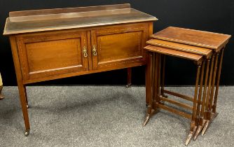 An Edwardian walnut side cabinet / hall table, 82.5cm high x 107cm wide x 48cm deep; a nest of three