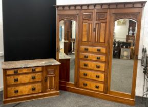 A Victorian walnut compactum wardrobe, and a matching washstand chest with three graduated long