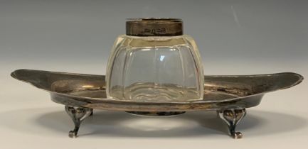 A George V silver oval inkstand, Birmingham 1920; a Continental silver coloured metal box, as a swan