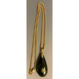 A Chinese green stone possibly nephrite jade pear drop pendant necklace, unmarked yellow metal