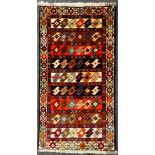 A North-west Persian Yallemeh rug / carpet, hand-knotted in rich tones of red, blue, orange, and