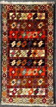 A North-west Persian Yallemeh rug / carpet, hand-knotted in rich tones of red, blue, orange, and