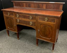 An early 20th century reproduction mahogany break-centre sideboard. Quarter galleried back, Kingwood