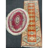 A Milas Seccade Yolluk wool runner, approx 288cm x 84cm; a Chinese oval rug, approx 150cm x 91cm (2)