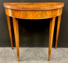 A 19th century style reproduction mahogany card-table, cross-banded Demi-lune shaped top, tapered